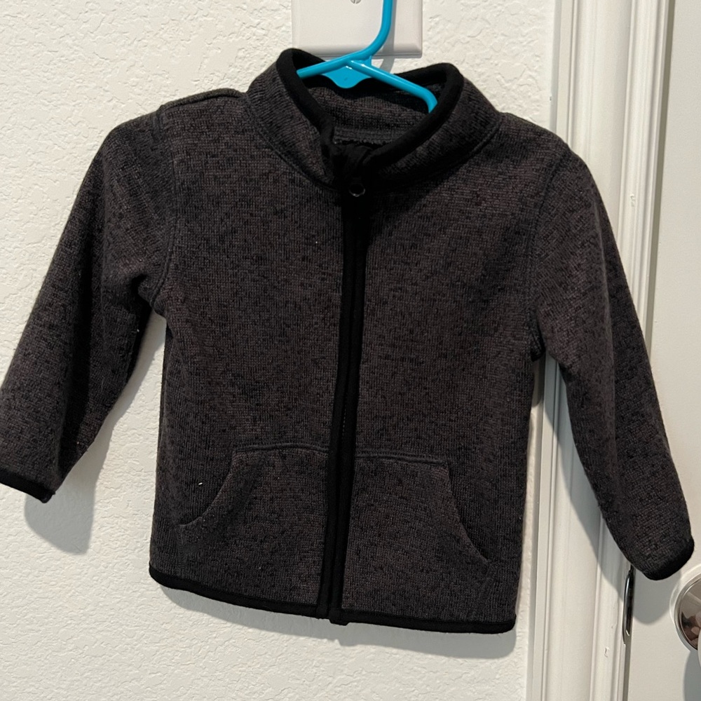 Gently used sweater / jacket. Black / Gray with zipper.